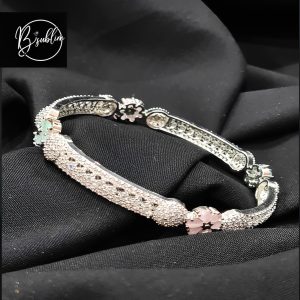 silver and gold bracelet with stone