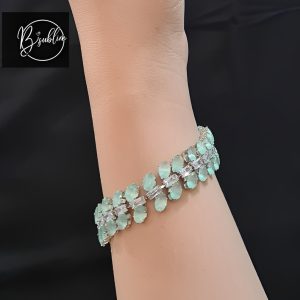 silver bracelet with lime green stone